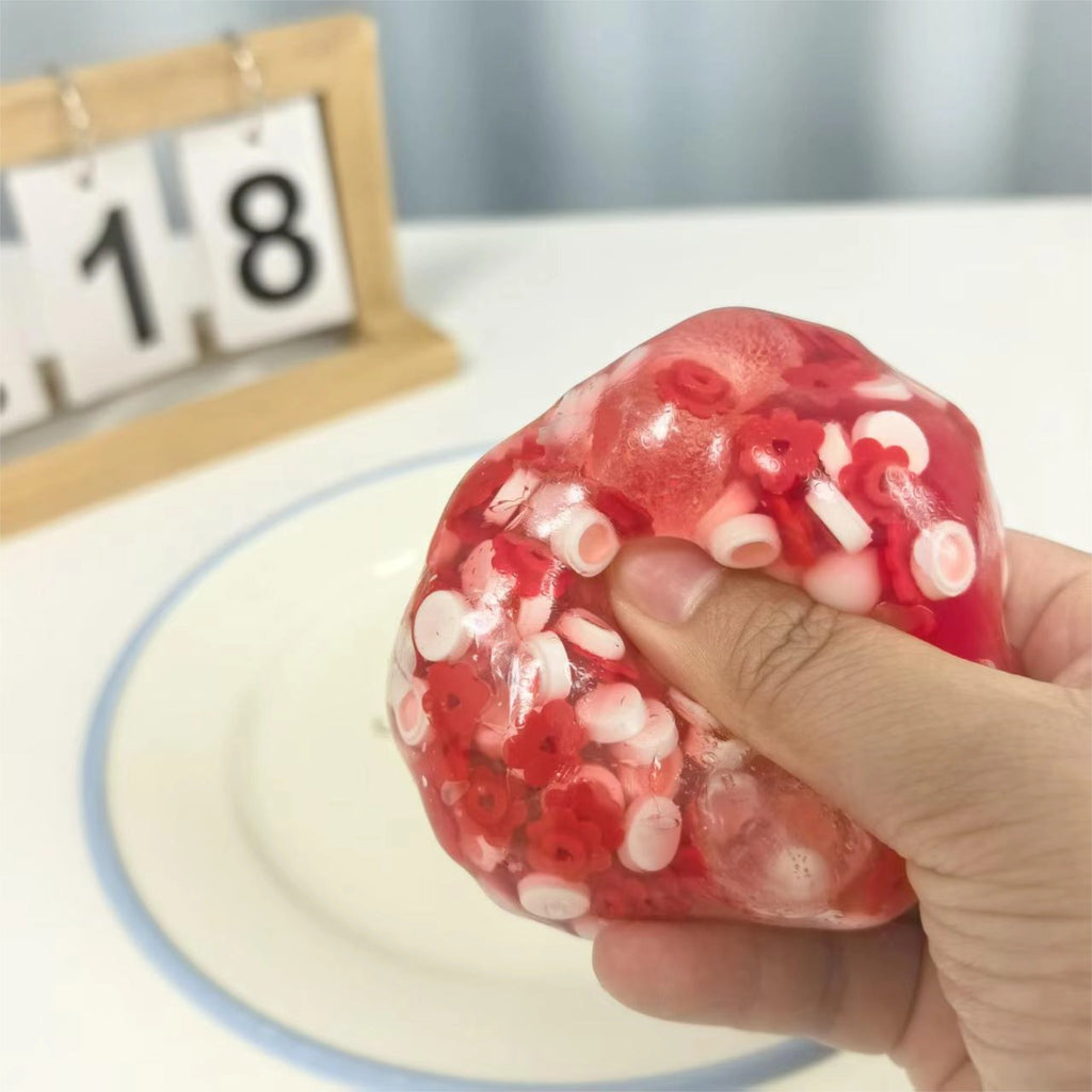 Squeezing the Strawberry Mochi Bloom stress ball