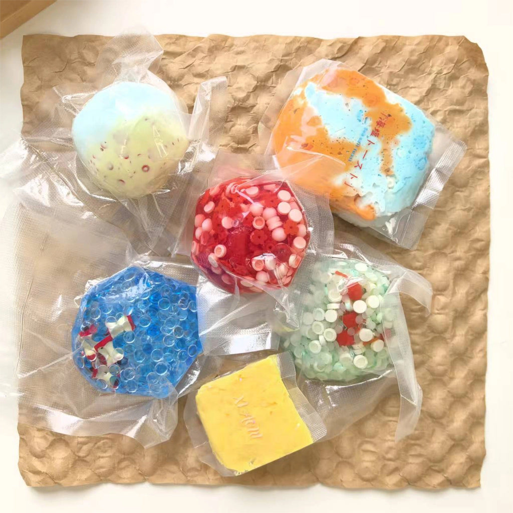 Collection of PopDen handmade squeeze balls in various colors