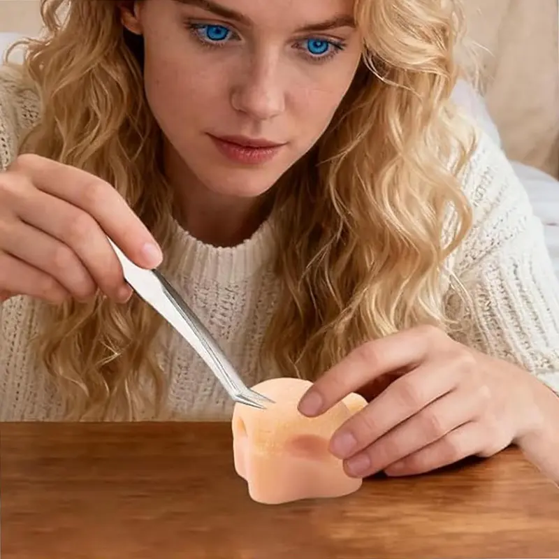 Strawberry nose squeeze toy - in use lifestyle