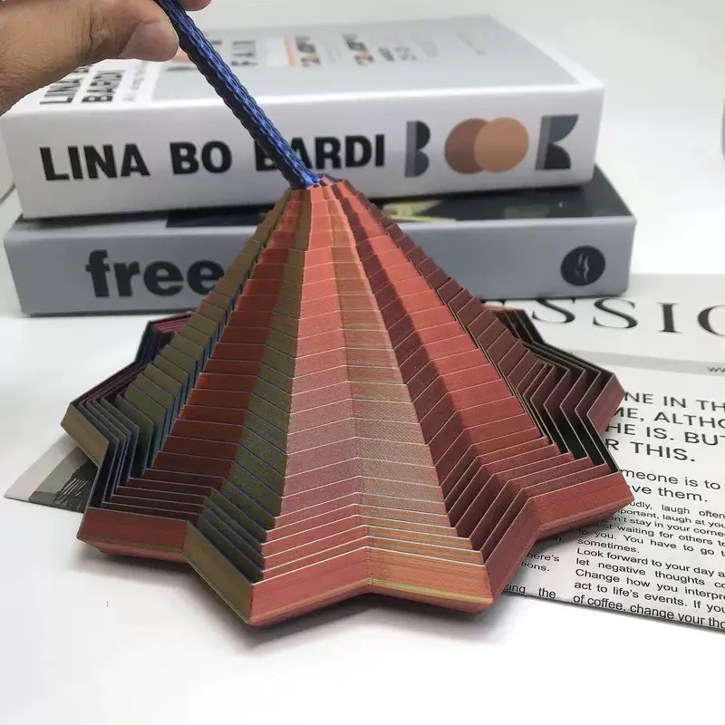 3D printed spinning top tower - side view lifted by string